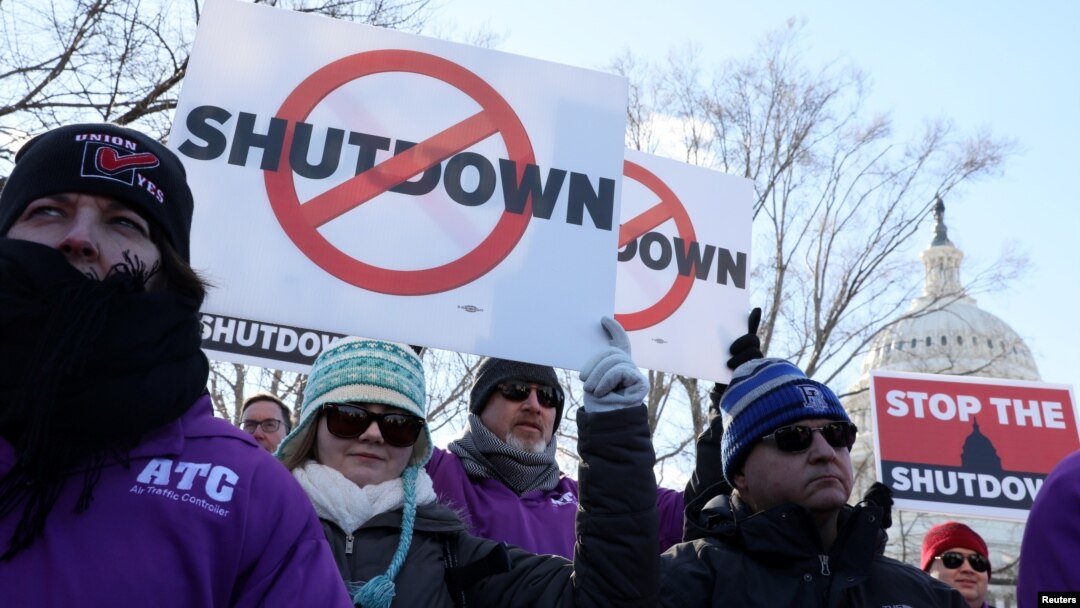 Federal air traffic controller union members protest the partial U.S. federal government shutdown at a rally at the U.S. Capitol in Washington, Jan. 10, 2019.