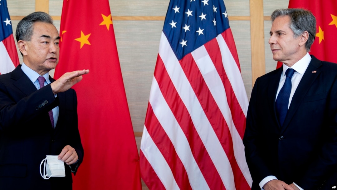 U.S. Secretary of State Antony Blinken, right, and China's Foreign Minister Wang Yi attend a meeting in Nusa Dua on the Indonesian resort island of Bali Saturday, July 9, 2022. 