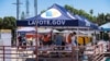 American-Thai voters line up to vote at a Mobile Vote Center
in Wat Thai of Los Angeles during early Midterm Election2022 in Los Angeles, CA. The Mobile Vote Center Program of Los Angeles County implemented and takes a community-based approach and collab