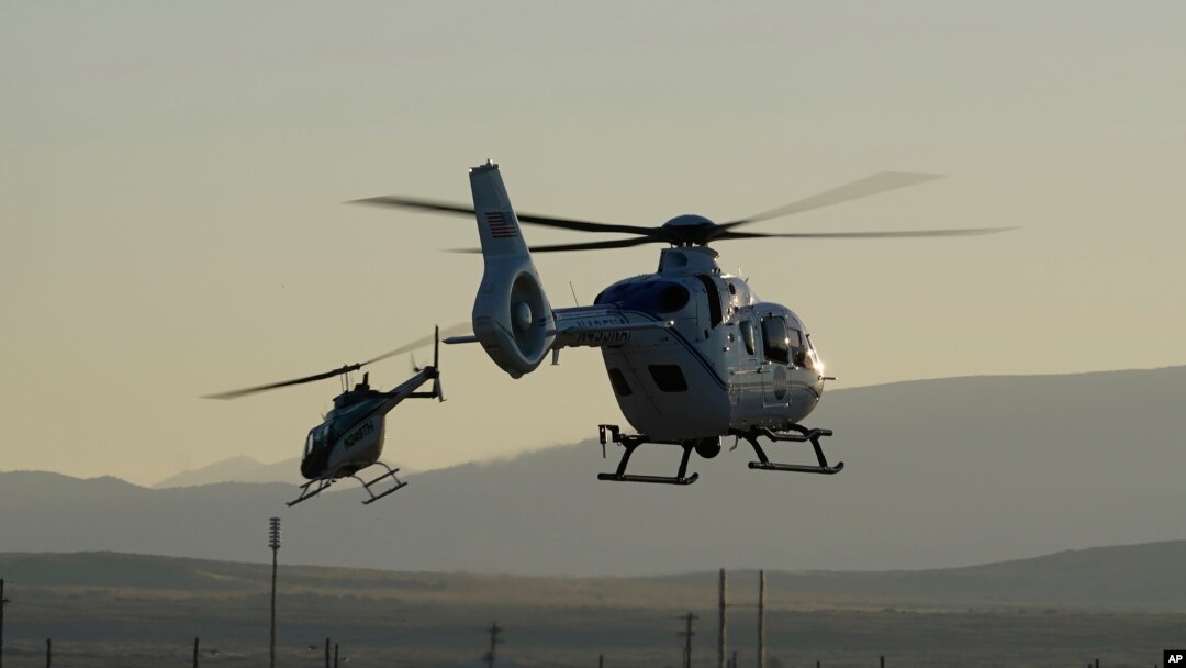 Helicopter recovery teams depart the Michael Army Air Field before the arrival of a space capsule carrying NASA's first asteroid samples, Sept. 24, 2023.