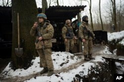 Soldiers of Ukraine's state border guard rest in Sumy region, Ukraine, Nov. 24, 2023. Nearly two years into the Russian invasion of Ukraine, instead of common crossing points between the countries, there are now military positions separated by the border.