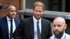 FILE - Britain's Prince Harry walks outside the High Court, in London, March 30, 2023. 