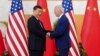 FILE - U.S. President Joe Biden, right, shakes hands with Chinese President Xi Jinping on the sidelines of a G20 summit in Bali, Indonesia, Nov. 14, 2022. 