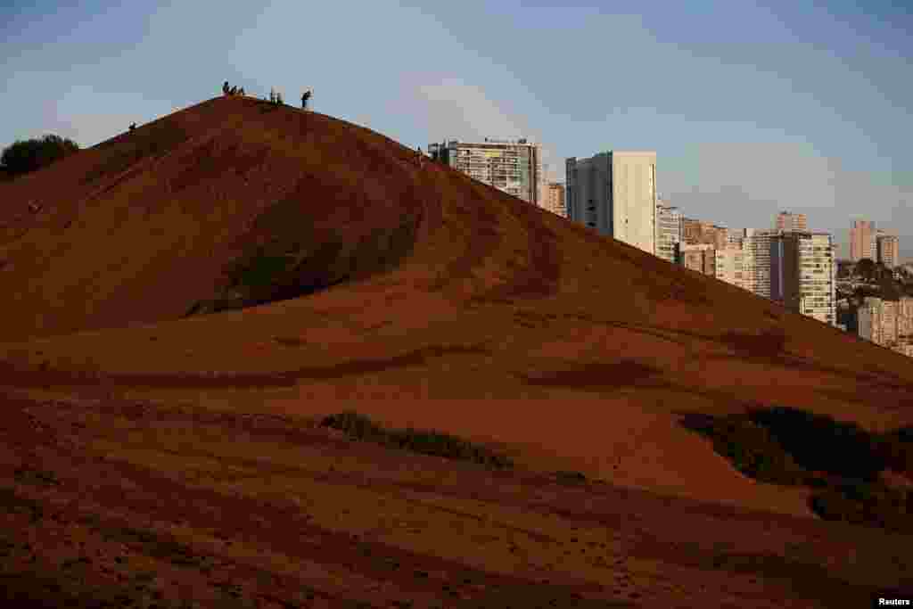 Luxurious seaside buildings are seen near the dunes in Concon, Chile, June 19, 2024.