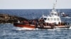 Migrants arrive on an Italian Coast Guard vessel after being rescued at sea, near the Sicilian island of Lampedusa, Italy, Sept. 18, 2023.