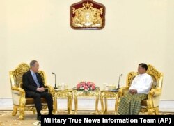 Senior Gen. Min Aung Hlaing, right, head of the military council, talks with former U.N. Secretary-General Ban Ki-moon, left, during their meeting, April 24, 2023, in Naypyitaw, Myanmar.
