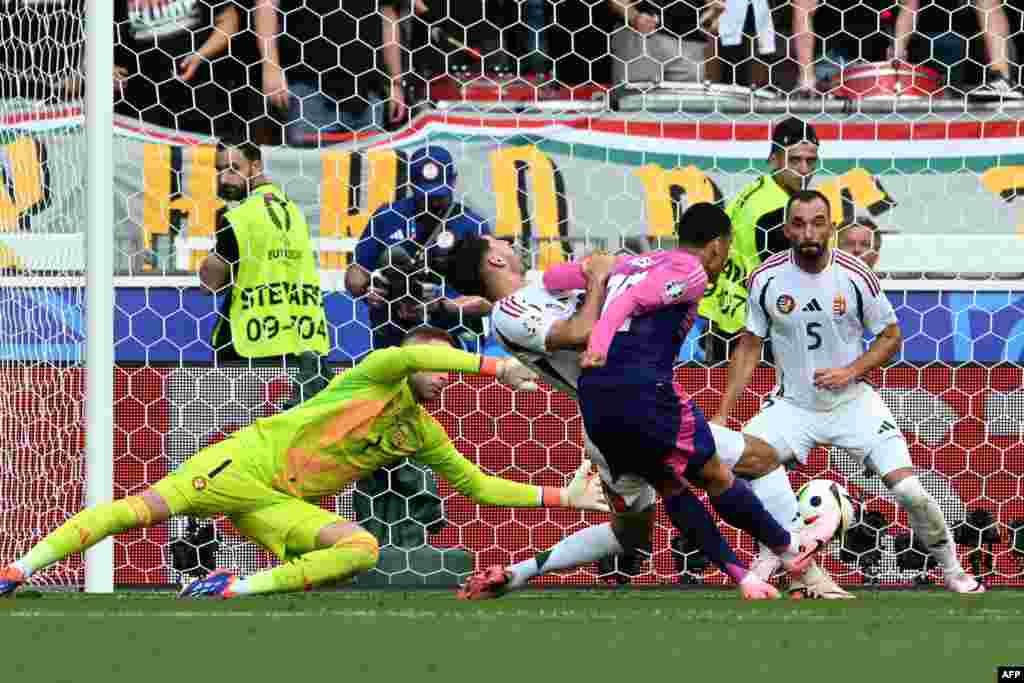Germany's midfielder #10 Jamal Musiala shoots to score his team's first goal during the UEFA Euro 2024 Group A football match between Germany and Hungary at the Stuttgart Arena in Stuttgart, Germany.