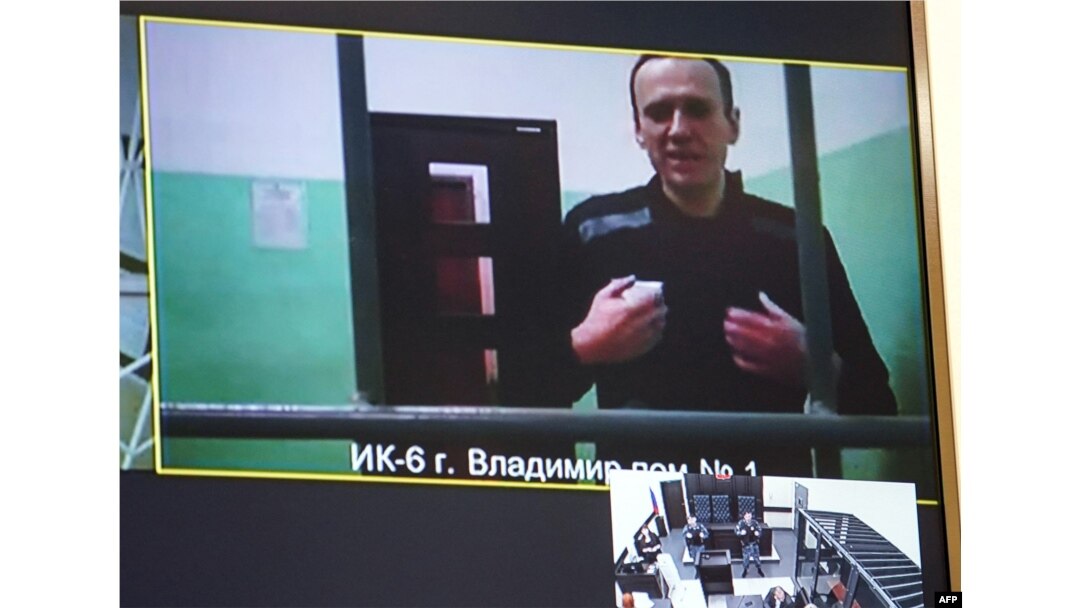 FILE - A screen shows jailed Kremlin critic Alexey Navalny as he arrives at a court in Moscow, on Sept. 26, 2023.