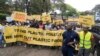 Climate activists carry banners and placards calling for a reduction in global plastic production ahead of the Intergovernmental Negotiating Committee on Plastic Pollution which will take place Nov. 13-19, in Nairobi, Nov. 11, ,2023. 