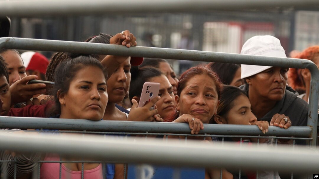 Friends and family members of inmates wait to hear news about their loved ones after deadly clashes at the Litoral Penitentiary, in Guayaquil, Ecuador, July 25, 2023. 