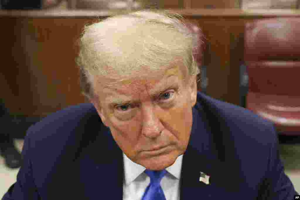 Former president Donald Trump awaits the start of proceedings at Manhattan criminal court in New York. Trump is accused of falsifying internal business records as part of an alleged scheme to bury stories he thought might hurt his presidential campaign in 2016.