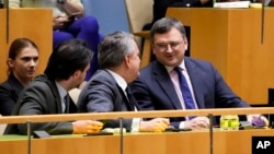 Dmytro Kuleba, Ukraine's foreign minister, right, and Sergiy Kyslytsya, permanent representative of Ukraine to the U.N., react after the U.N. General Assembly voted in favor of a resolution supporting Ukraine, Feb. 23, 2023, at U.N. headquarters.