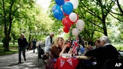 People take part in a Coronation Big Lunch in Regent's Park, London, Sunday May 7, 2023. Thousands of people across the country are celebrating the Coronation Big Lunch to mark the crowning of King Charles III and Queen Camilla.