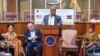 FILE- Signing ceremony featuring Newark’s mayor (center) and a supposed representative of the fake country of Kailasa (second from the left), Newark, New Jersey, Jan. 12, 2023.