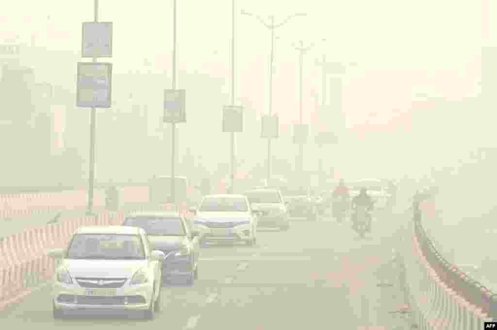 Commuters make their way through heavy smog in Amritsar, India.