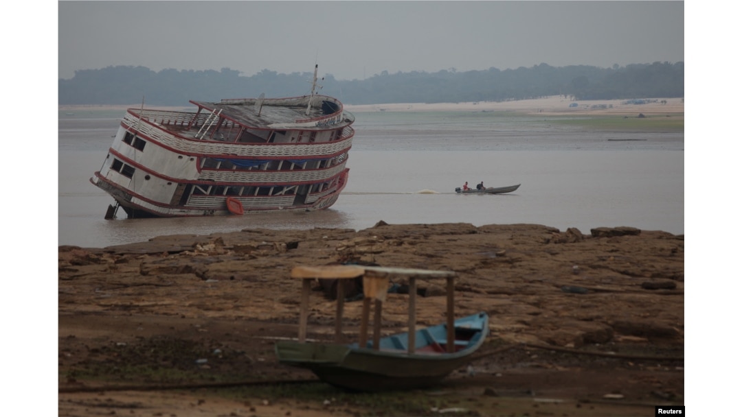 Boats are seen stranded at David's Marina, as the water level at a major river port in Brazil's Amazon rainforest hit its lowest point in at least 121 years on Monday, at the Rio Negro River in Manaus, Brazil, Oct. 16, 2023.