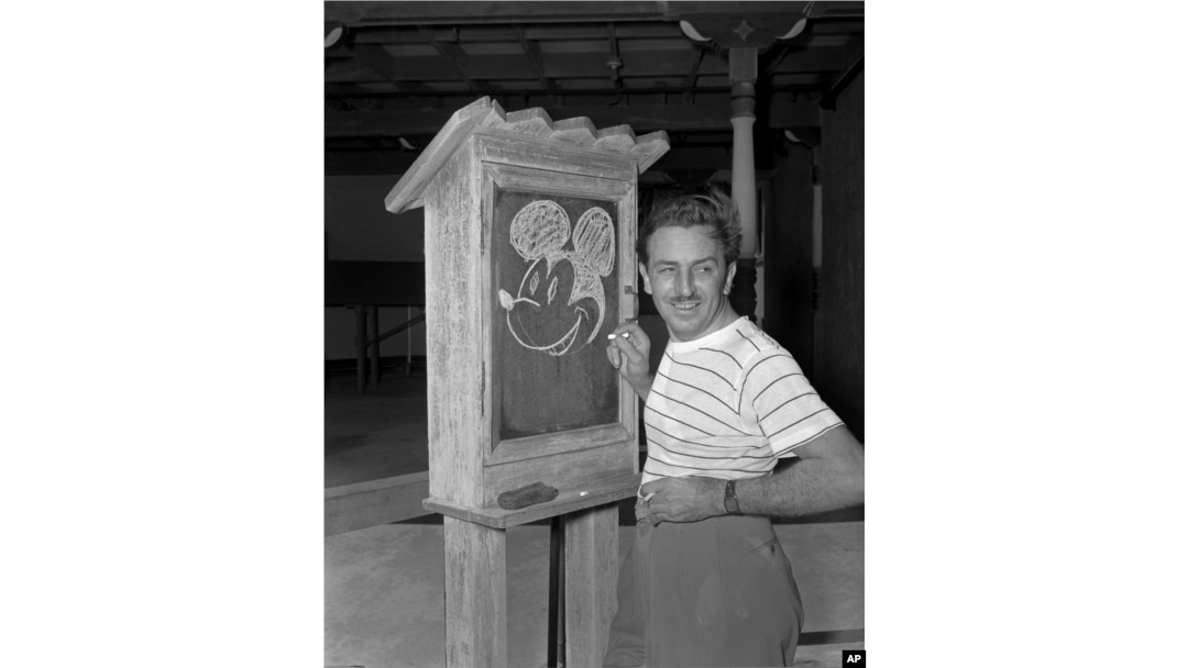 FILE - Walt Disney, creator of Mickey Mouse, poses for a photo at the Pancoast Hotel, Aug. 13, 1941, in Miami, Fla. The earliest version of Mickey Mouse will become public domain on Jan. 1, 2024. (AP Photo, File)