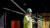 FILE - A construction worker carries scaffolding parts on March 14, 2024, in Boston. The first job report of Donald Trump’s second presidency suggested that he inherited a labor market that is solid but unspectacular.