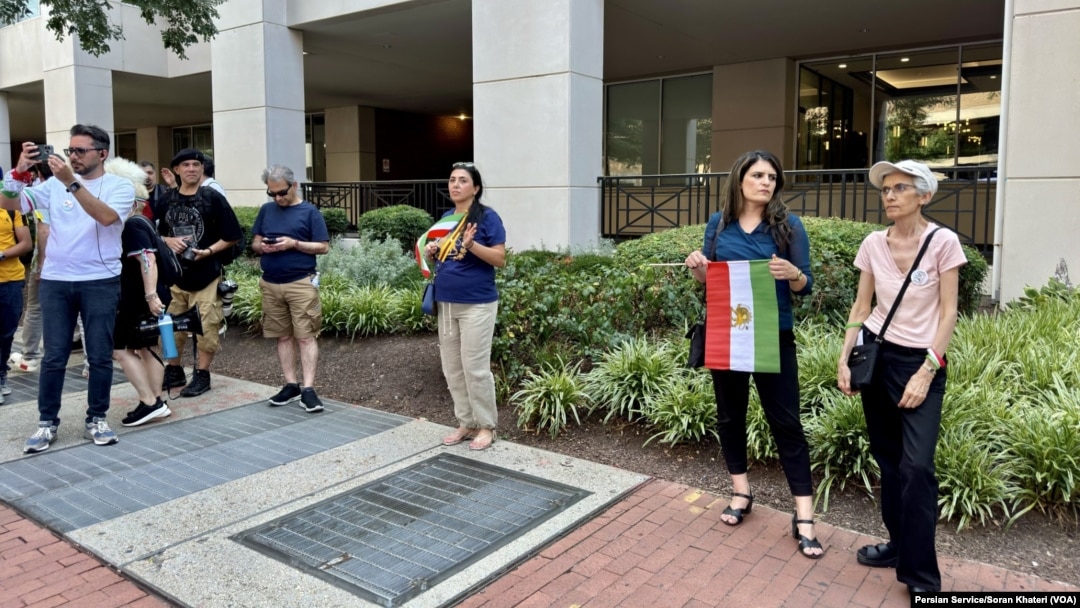 Iranian Americans protest outside Iran’s interests section office in Washington, June 28, 2024, as it hosts an absentee voter ballot station for the first round of the Iranian presidential election.