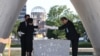 Hiroshima Mayor Kazumi Matsui and representatives of bereaved families enshrine a list of the atomic bomb victims at the cenotaph during a ceremony at the Peace Memorial Park in Hiroshima, Aug. 6, 2023.
