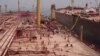 A view of a pipe laid between the decaying supertanker FSO Safer and its replacement tanker, the Nautica, off the coast of Ras Issa, Yemen, in pictured in this screengrab from a recent undated handout video.