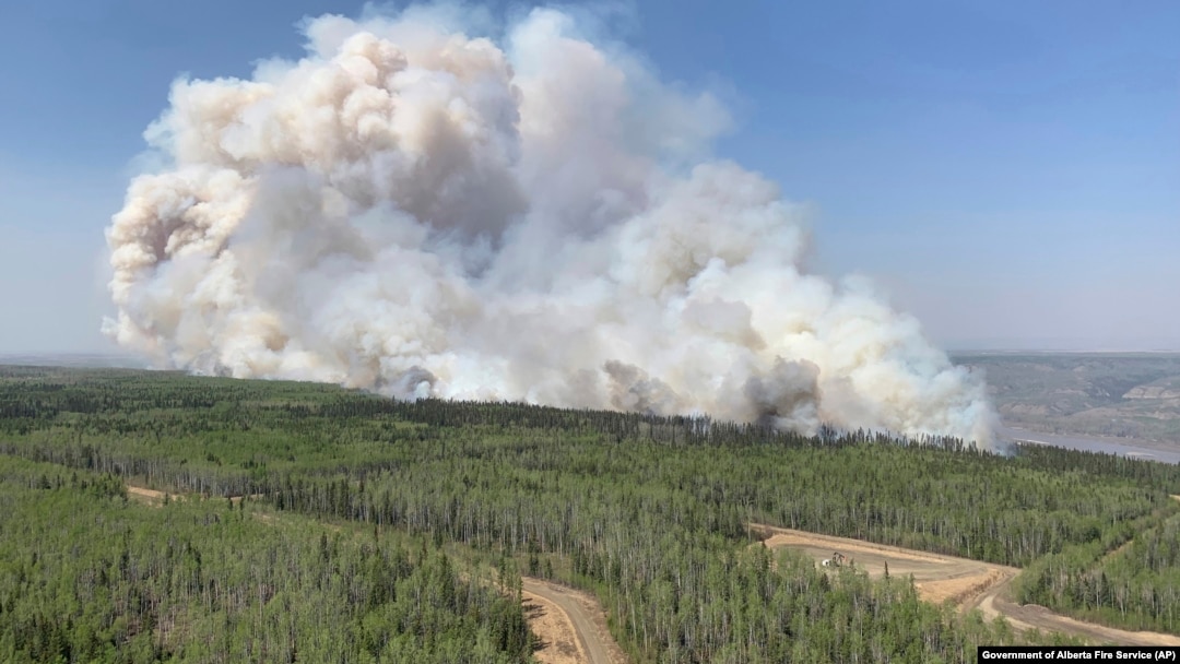 In this photo provided by the Government of Alberta Fire Service, a wildfire burns a section of forest in the Grande Prairie district of Alberta, Canada, May 6, 2023. 