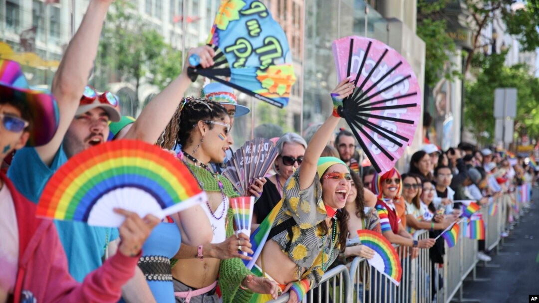 Revelers cheer along the route during a Pride Parade, in San Francisco, California, June 30, 2024.