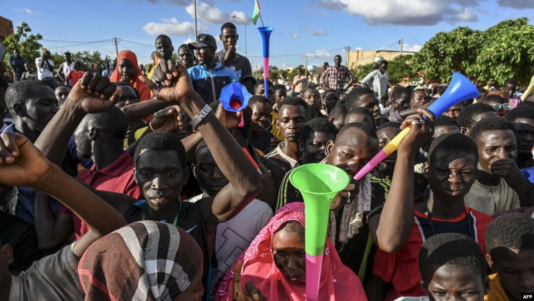 Supporters of Niger's National Council of Safeguard of the Homeland (CNSP), are seen outside a Nigerien airbase housing French troops in Niamey, Sept. 3, 2023, demanding their departure from Niger.