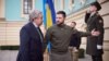 This handout picture taken and released by Ukrainian Presidential Press Service on March 8, 2023, shows Ukrainian President Volodymyr Zelenskyy, right, welcoming Secretary-General of the United Nations Antonio Guterres, in Kyiv, Ukraine.