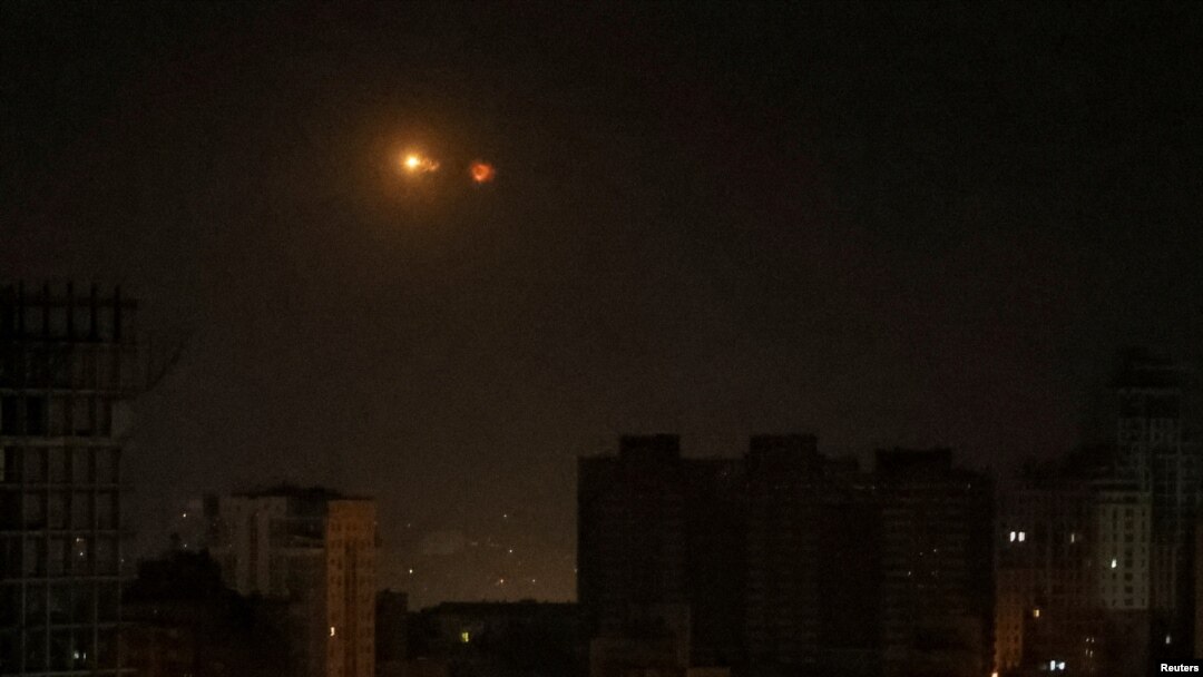 An explosion of a drone is seen in the sky over the city during a Russian drone strike, amid Russia's attack on Ukraine, in Kyiv, Ukraine May 25, 2023.