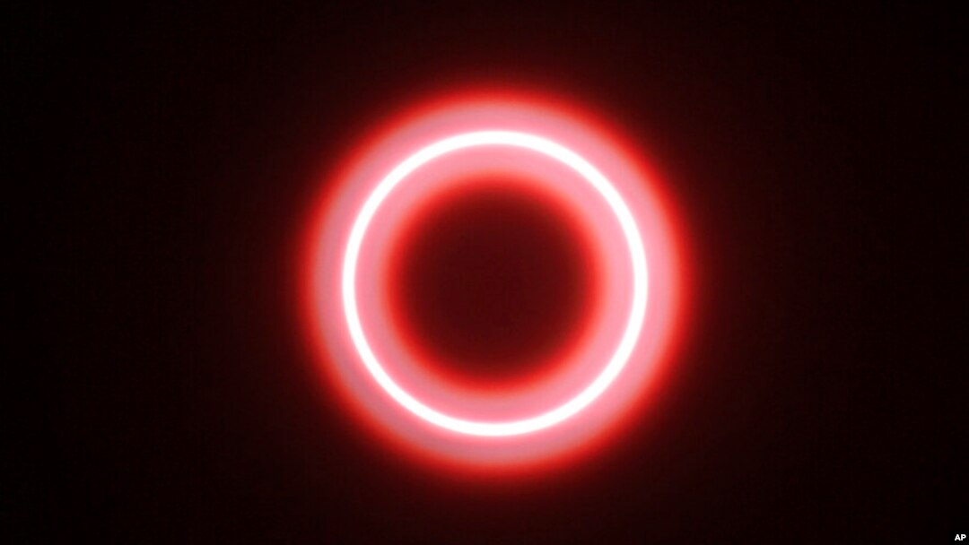 FILE - An annular solar eclipse is seen though safety glass from Siak, Riau province, Indonesia, Dec. 26, 2019. A "ring of fire" eclipse will be visible over parts of the western U.S. and Central and South America on Oct. 14, 2023.