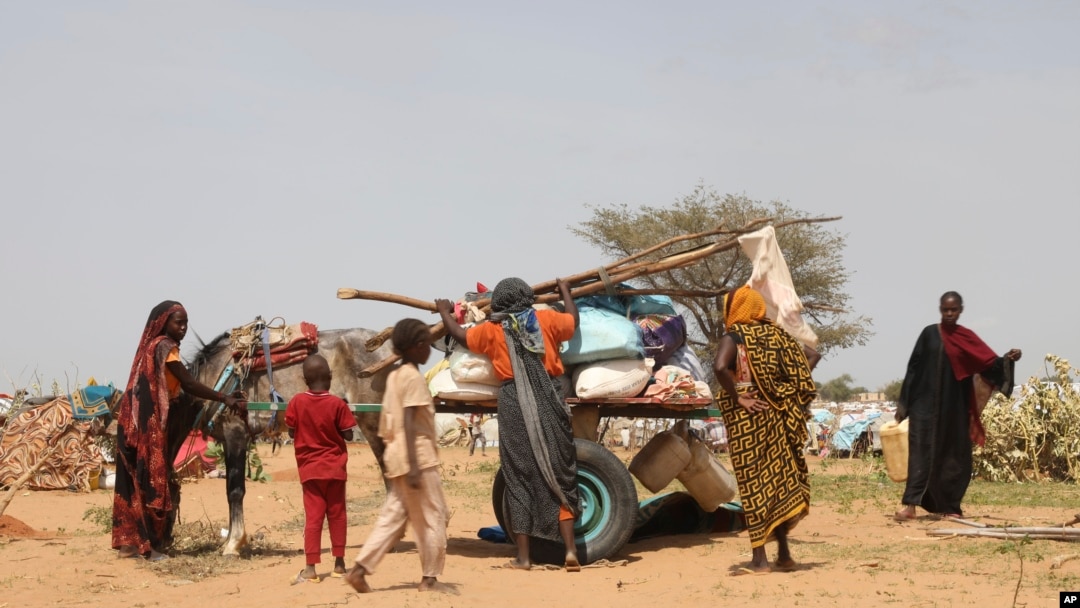 FILE- Sudanese refugees who fled the conflict in Sudan gather July 1, 2023 at the Zabout refugee Camp in Goz Beida, Chad.