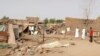 People check the rubble of their destroyed home after strikes at Allamat district in Khartoum, Sudan, June 1, 2023.