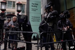 Media waits outside the High Court for the arrival of Prince Harry in London, June 5, 2023.