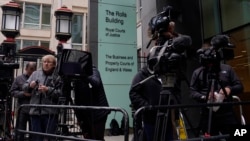 Media waits outside the High Court for the expected arrival of Prince Harry in London, June 5, 2023. 