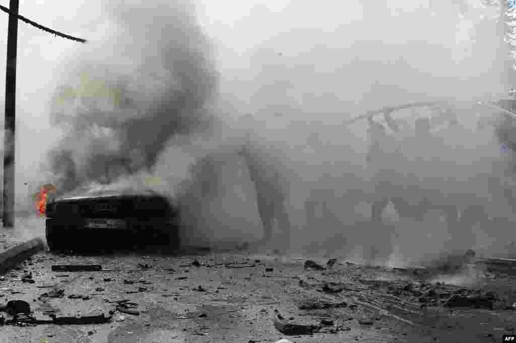 Lebanese firefighters put out a fire in a car after an Israeli strike in the southern city of Sidon. An Israeli strike in Sidon killed a Fatah official, said a leader from the Palestinian group and a security source, marking the first such attack reported on Fatah in over 10 months of cross-border clashes.