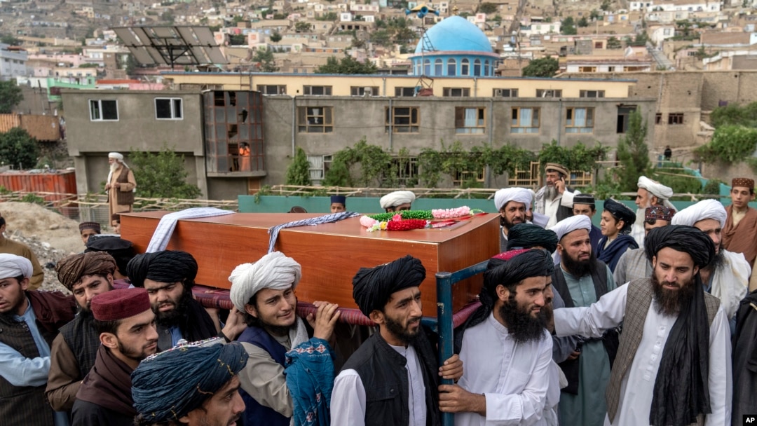 Mourners carry the body of a victim of a mosque bombing in Kabul, Afghanistan, Aug. 18. 2022. The bombing at a Kabul mosque during evening prayers on Wednesday killed at least 10 people, including a prominent cleric, and wounded over two dozen, 