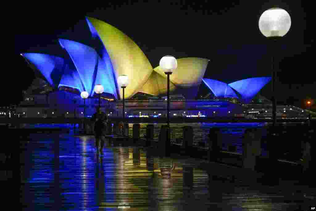 The Opera House in Sydney, Australia, is illuminated with the colors of Ukraine's national flag in solidarity with the country's people and government currently being invaded by Russia.