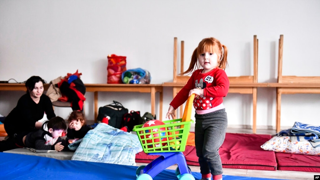 A girl plays at a temporary refugee shelter in Zahony, Hungary, near the Ukrainian border, Feb. 25, 2022.