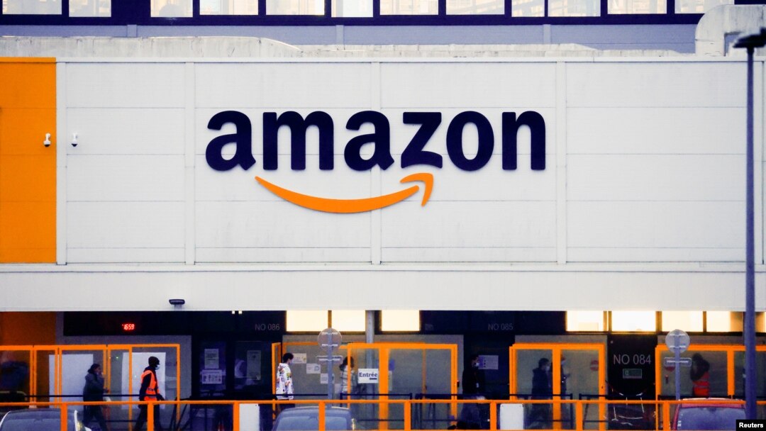 The Amazon logo is seen at the company's logistics center in Bretigny-sur-Orge, near Paris, France, Dec. 7, 2021. 