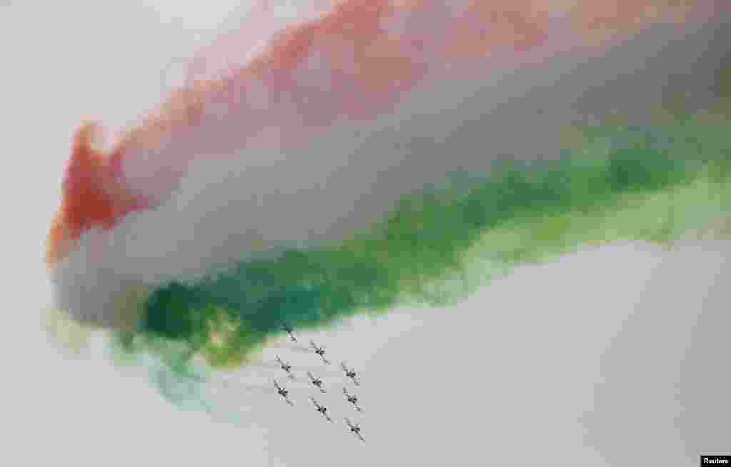 The aerobatic demonstration team of the Italian Air Force, Frecce Tricolori, performs before the start of the race of the Emilia Romagna Formula One Grand Prix at the Autodromo Internazionale Enzo e Dino Ferrari race track in Imola, Italy.