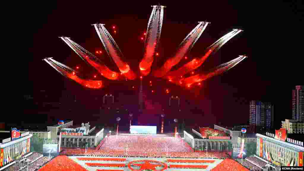 Planes perform an aerial display during a nighttime military parade to mark the 90th anniversary of the founding of the Korean People's Revolutionary Army in Pyongyang, North Korea, in this undated photo released by North Korea's Korean Central News Agency.