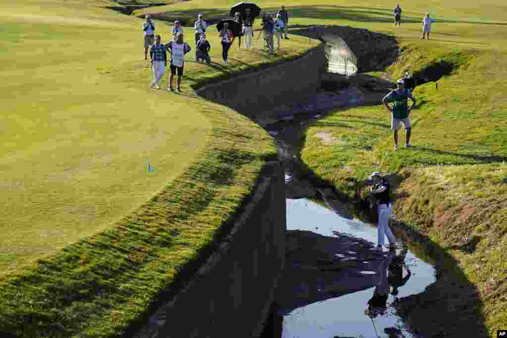 Jin Young Ko hits from a creek bed between the 17th and 18th holes during the third round of LPGA's DIO Implant LA Open golf tournament at Wilshire Country Club, April 23, 2022, in Los Angeles, California.