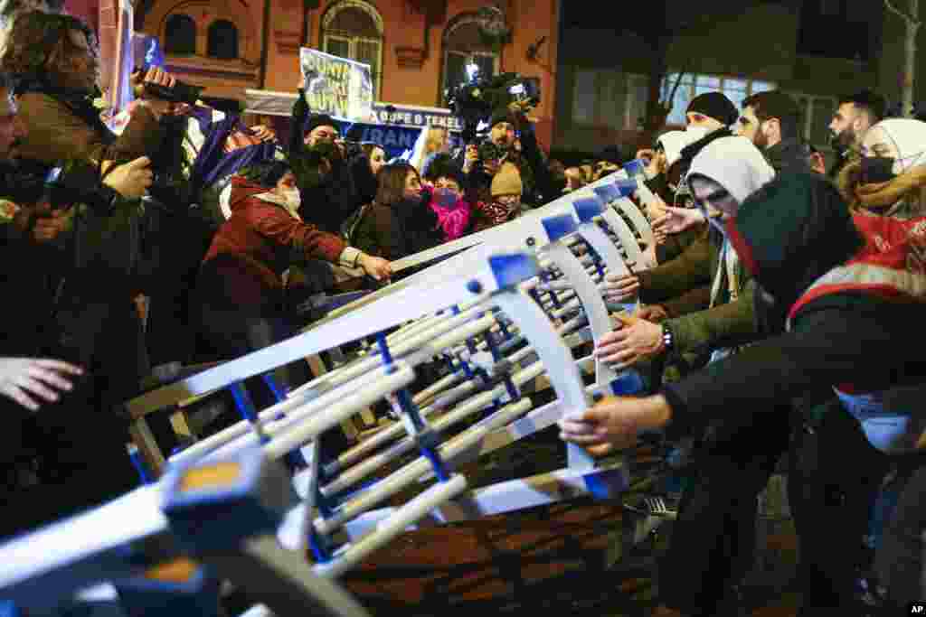 Policemen scuffle with protesters during a march to mark International Women's Day, in Istanbul, Turkey.