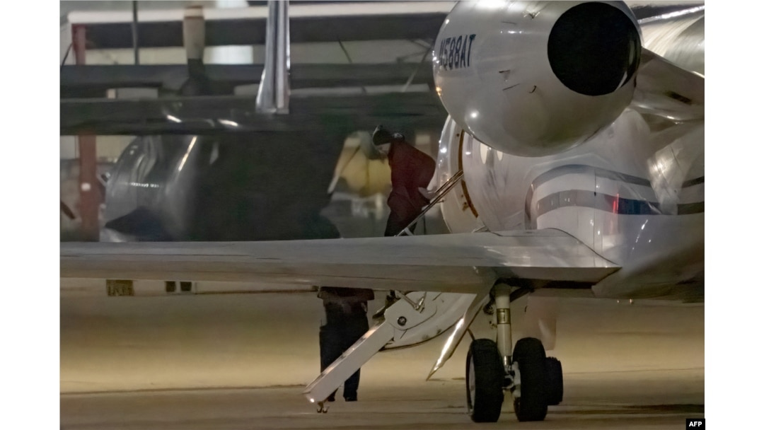WNBA star Brittney Griner exits a plane in San Antonio, Texas, after she was released from a Russian prison in exchange for an arms dealer.