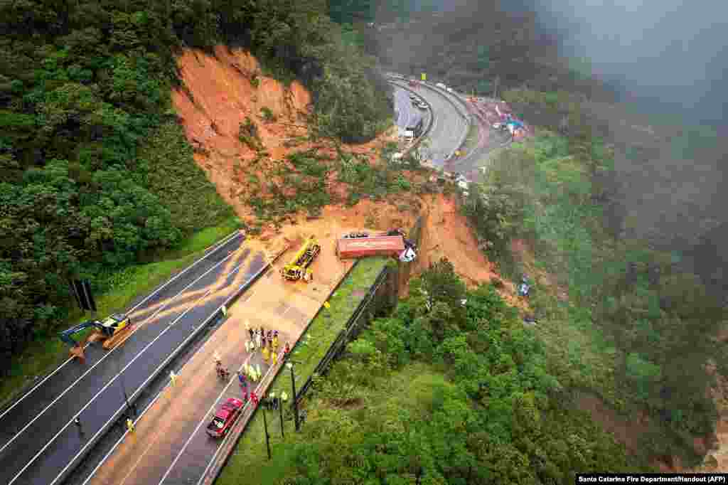 This handout picture released by the Santa Catarina Fire Department shows the BR-367 highway blocked after a landslide in Guaratuba, Parana state, Brazil, Nov. 30, 2022.