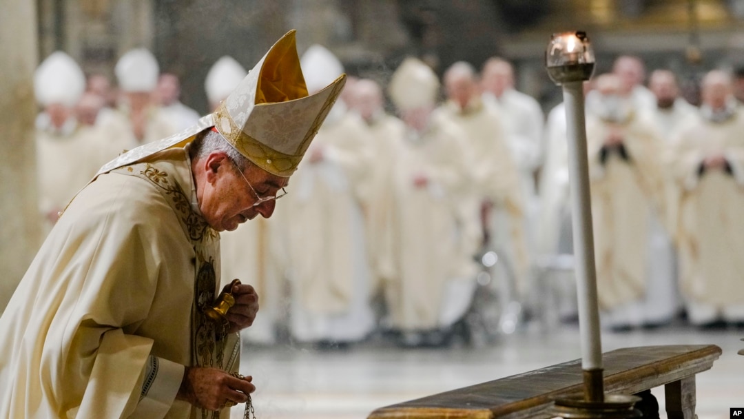 Cardinal Angelo De Donatis celebrates Mass for the health of Pope Emeritus Benedict XVI inside the St. John at the Lateran Basilica in Rome, Dec. 30, 2022.