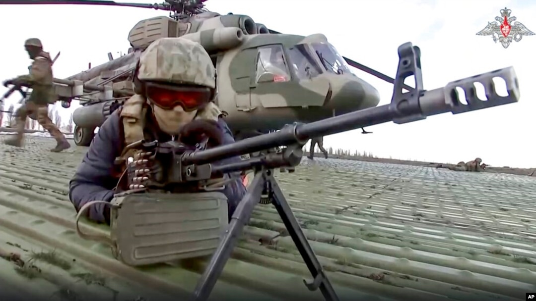 Russian soldiers take their position upon landing at an unspecified location in Ukraine, in this handout photo taken from video released by Russian Defense Ministry Press Service on Dec. 6, 2022.