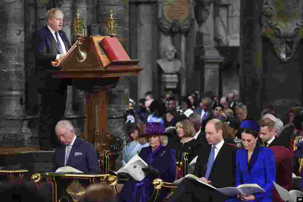 Britain's Prime Minister Boris Johnson delivers a speech as Prince Charles, left, Camilla, Duchess of Cornwall, Prince William and Kate, Duchess of Cambridge, right, attend the Commonwealth Service on Commonwealth Day at Westminster Abbey in London.