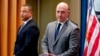 U.S. Attorney Breon Peace, left, and Alan Kohler Jr., assistant director of the FBI's Counterintelligence Division, arrive at a news conference at the Justice Department in Washington, March 16, 2022, to discuss recent law enforcement actions to address transnational repression.